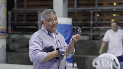 武陵社區發展協會古建明理事長分享說明改良式獵具操作及捕抓獵物成果