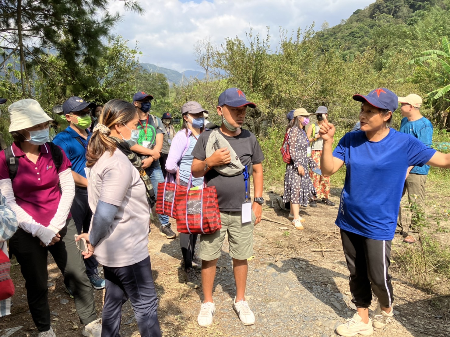 “Take a look at my little dinosaurs”: Ms. Mei-Lan He proudly introduces her
  chicken to TPSI partners © 2022 TPSI-W